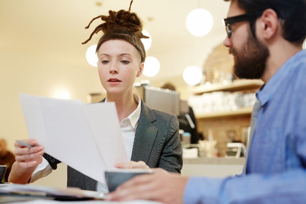 woman with man shocked to read the lawsuit notice