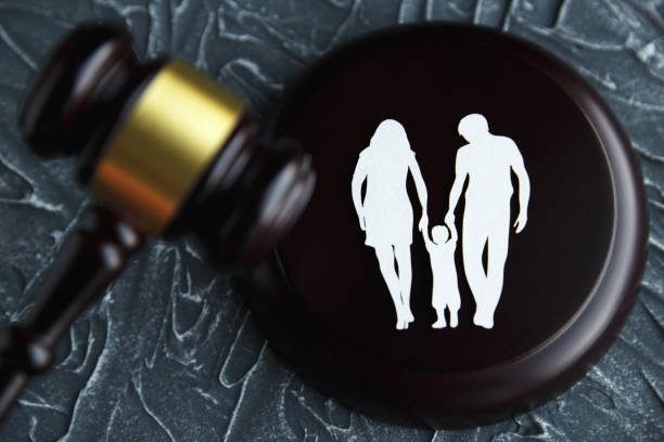 Family figure and gavel on table. Family law concept