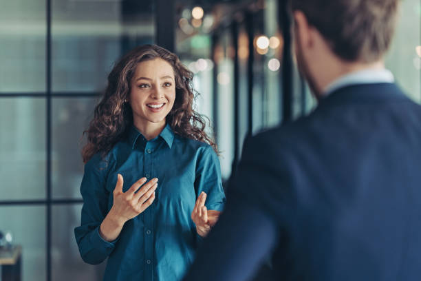 Businesswoman and businessman talking in the office