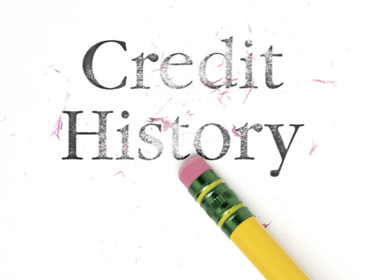 The words credit history written in pencil and an eraser is erasing the words