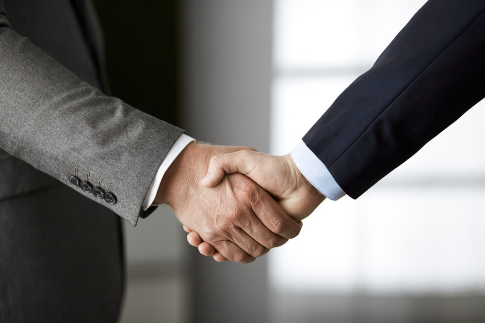 Two businessmen shaking hands