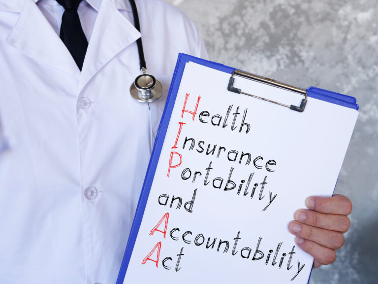 Medical professional holding a clipboard with "HIPAA authorization form for parents of college student" written on it.