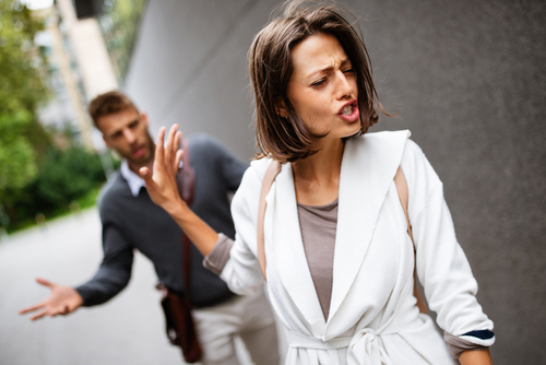 Sad young woman and man outdoor on street having relationship problems, my wife moved out what are my rights