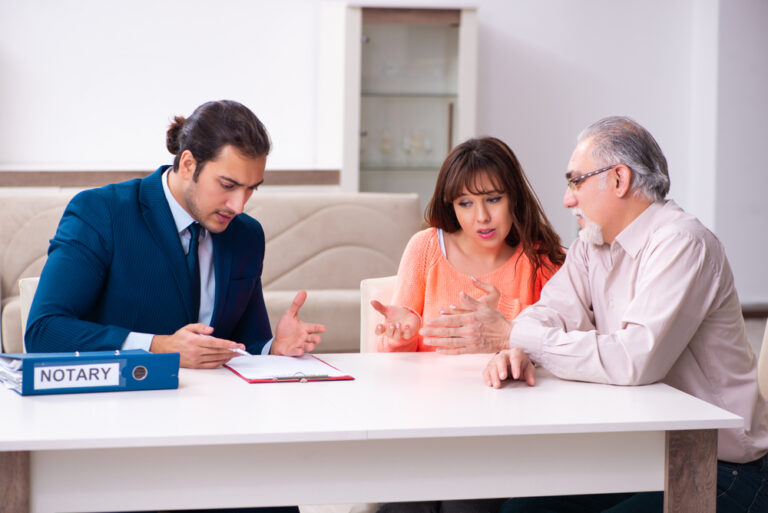 Young male lawyer, old man and his granddaughter in testament co