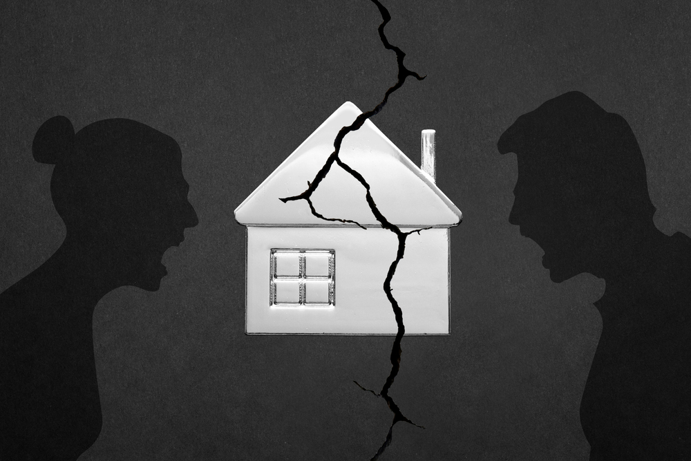 Silhouette of a married couple. The concept of dividing property. Arguing people. Yelling at each other. Showdown. Defending your point of view.  Conflict. The destruction of marriage