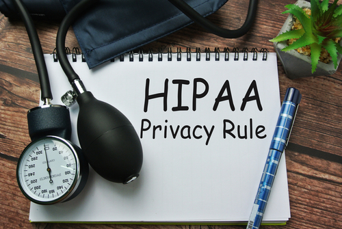 Selective focus of pen, sphygmomanometer, inscription with notebook written with HIPAA ( Health Insurance Portability and Accountability Act ) Privacy Rule. 