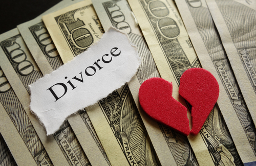 Broken red heart and Divorce paper note on cash                               