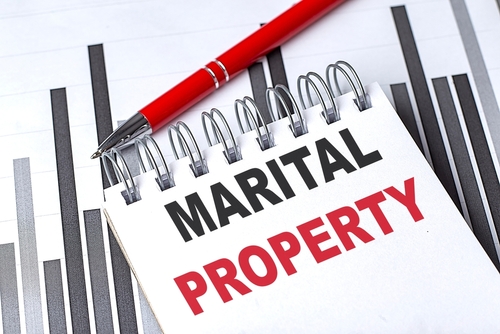 MARITAL PROPERTY text on a notebook on chart with pen . how is an llc treated in a divorce in texas