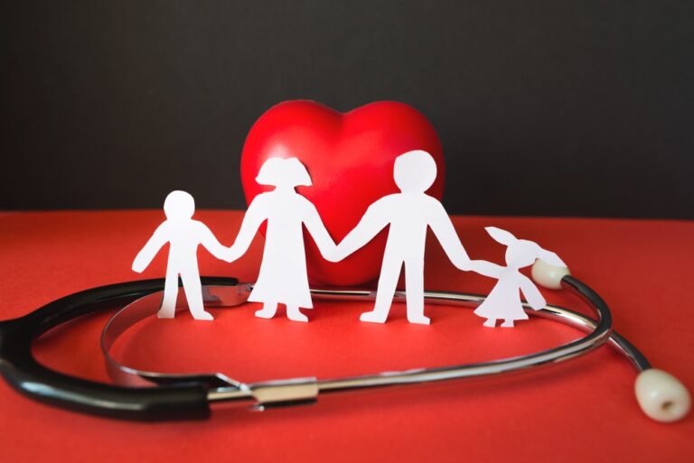 Family paper cut with red heart and stethoscope, heart health, family health insurance concept, Red Cross CPR, World Heart Day, World Health Day, life insurance