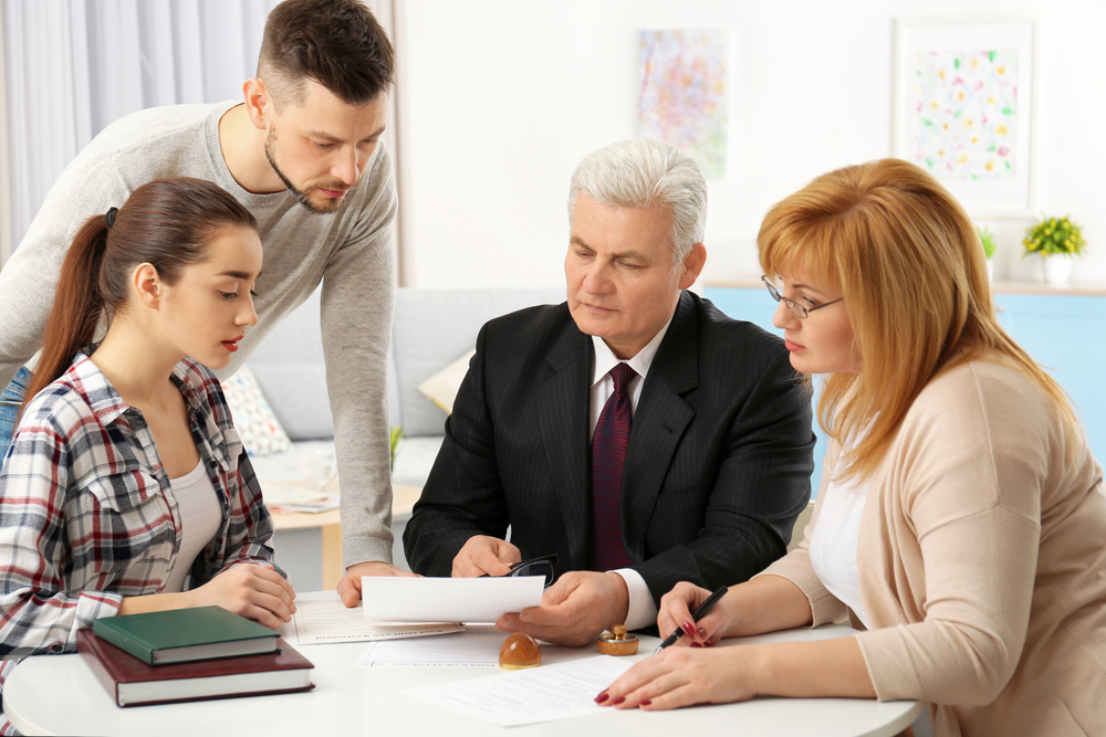 lawyer sitting with clients