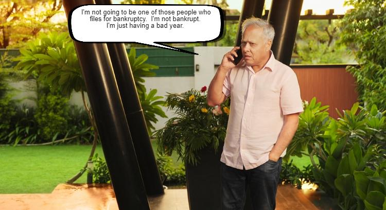 An older man in a pink shirt talks on a mobile phone in a garden, looking frustrated. A comic-style speech bubble shows his dialogue about weighing his options for filing Chapter 7 bankruptcy.