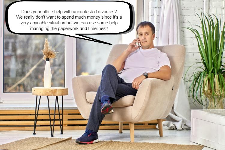 A man sitting in a beige armchair, holding a phone to his ear, is asking why the uncontested divorce is taking so long and mentions needing help with paperwork and timelines.