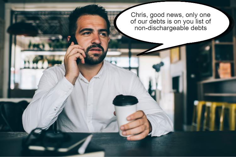 Man in a white shirt, holding a coffee cup and talking on the phone in a cafe. Speech bubble says, "Chris, good news, only one of our debts is on your list of non-dischargeable debts.