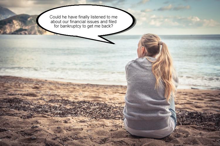 A woman sits on a beach facing the water, with a speech bubble that says, "Could my separated husband have finally listened to me about our financial issues and filed for Chapter 7 bankruptcy to get me back?