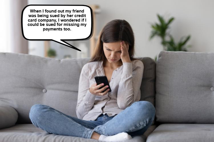 A worried woman sits on a couch, anxiously glancing at her phone. Her speech bubble reveals her concern